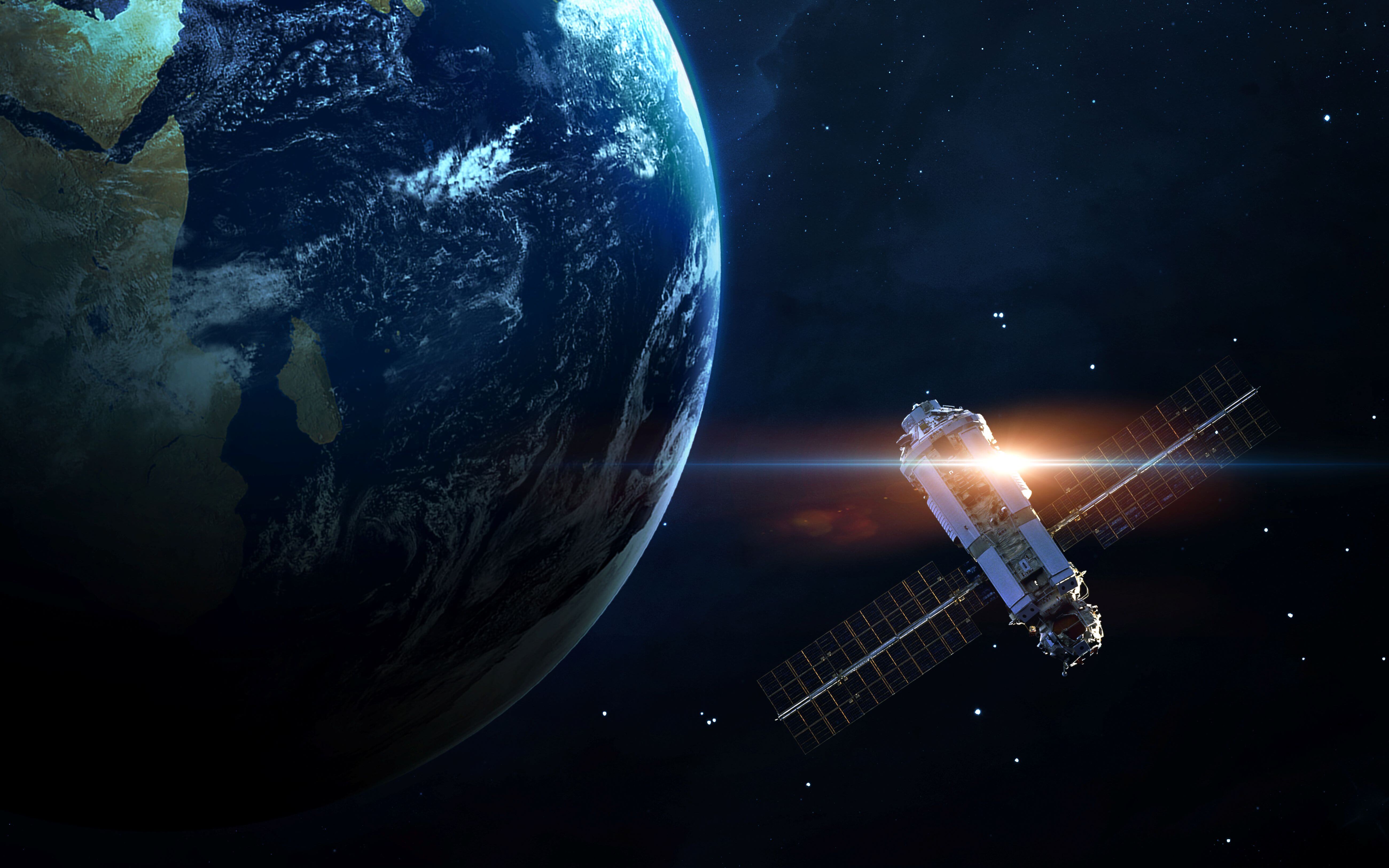 Satellite orbiting Earth – demonstrating the precision and reliability of bearings in aerospace engineering.
